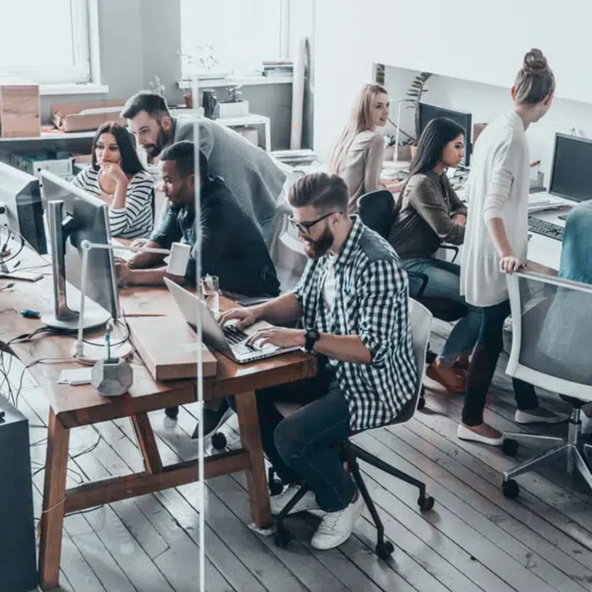 A group of entrepreneurs working in a small start-up office