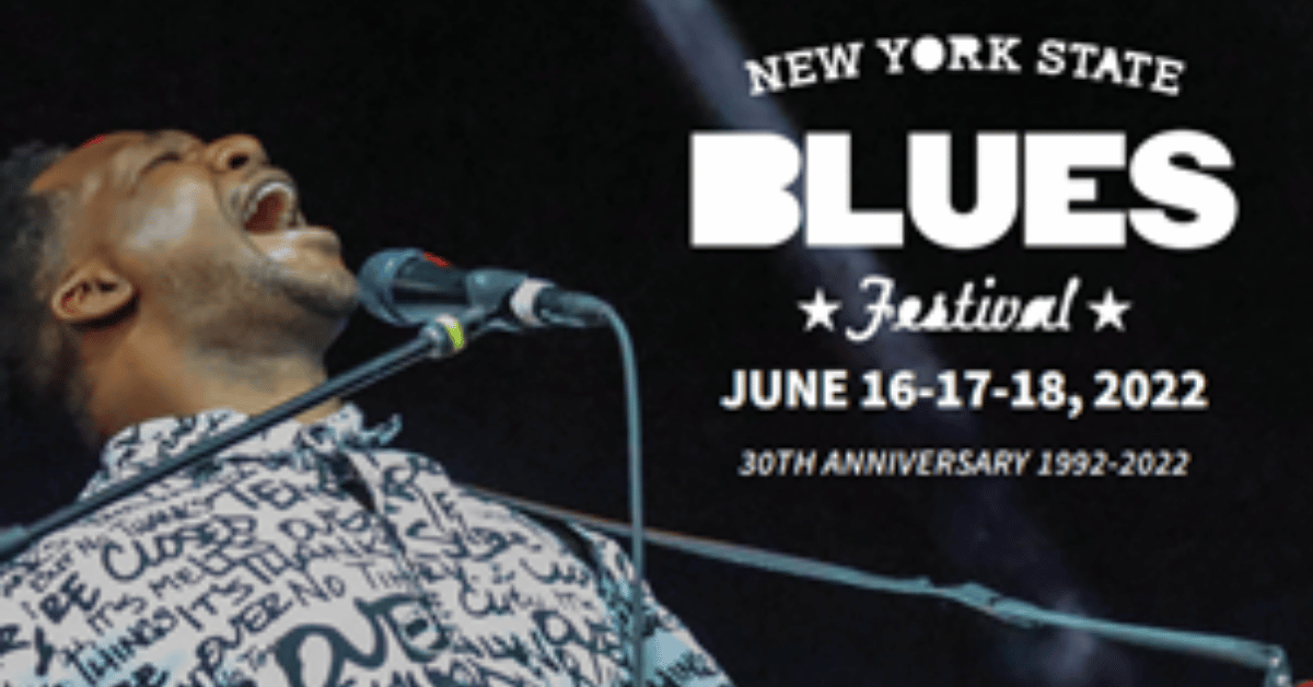 Man singing and playing guitar, bluesfest logo in upper right corner